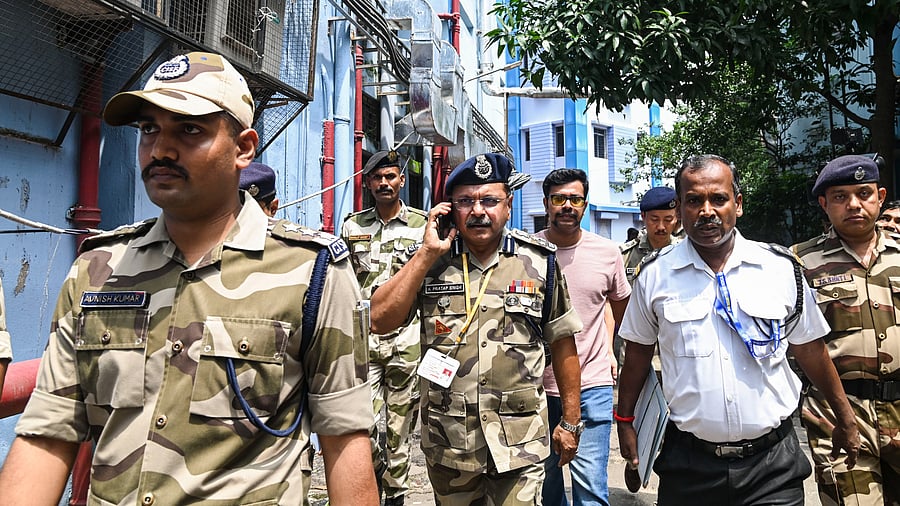 <div class="paragraphs"><p>CISF DIG K Pratap Singh (C) with jawans inspects R G Kar Medical College and Hospital for their deployment for security pupose in view of protests over recent rape and murder of a woman trainee doctor, in Kolkata, Wednesday.</p></div>
